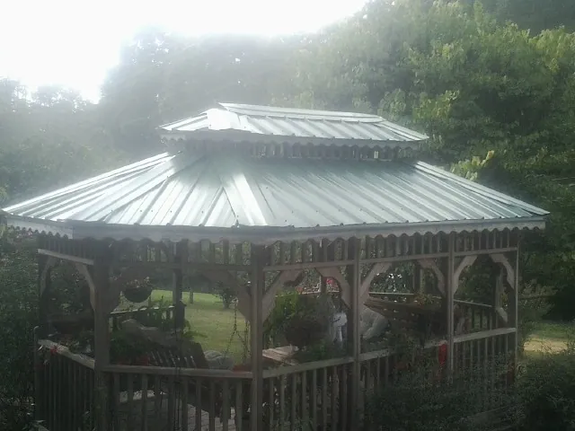 Two tier green metal roof on a garden gazebo in Keedysville